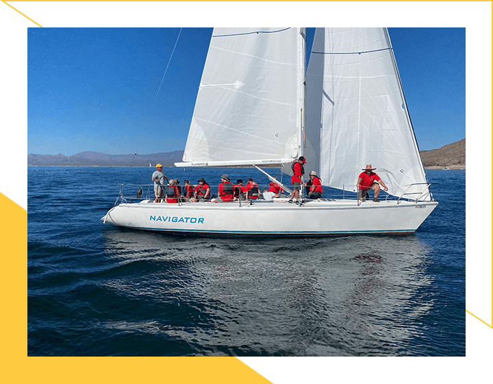 People Sailing on Sailboat With Wearing Red Dress